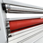 Pressure rollers and feed-in table of a used Crest MLC-1600 laminator