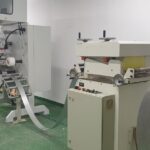 Graphic laminator with loop control and vertical aluminium decoiler of a refurbished license plate line